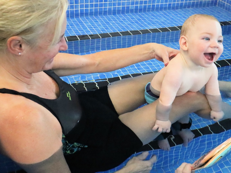 Hydrotherapy practitioner with baby in pool